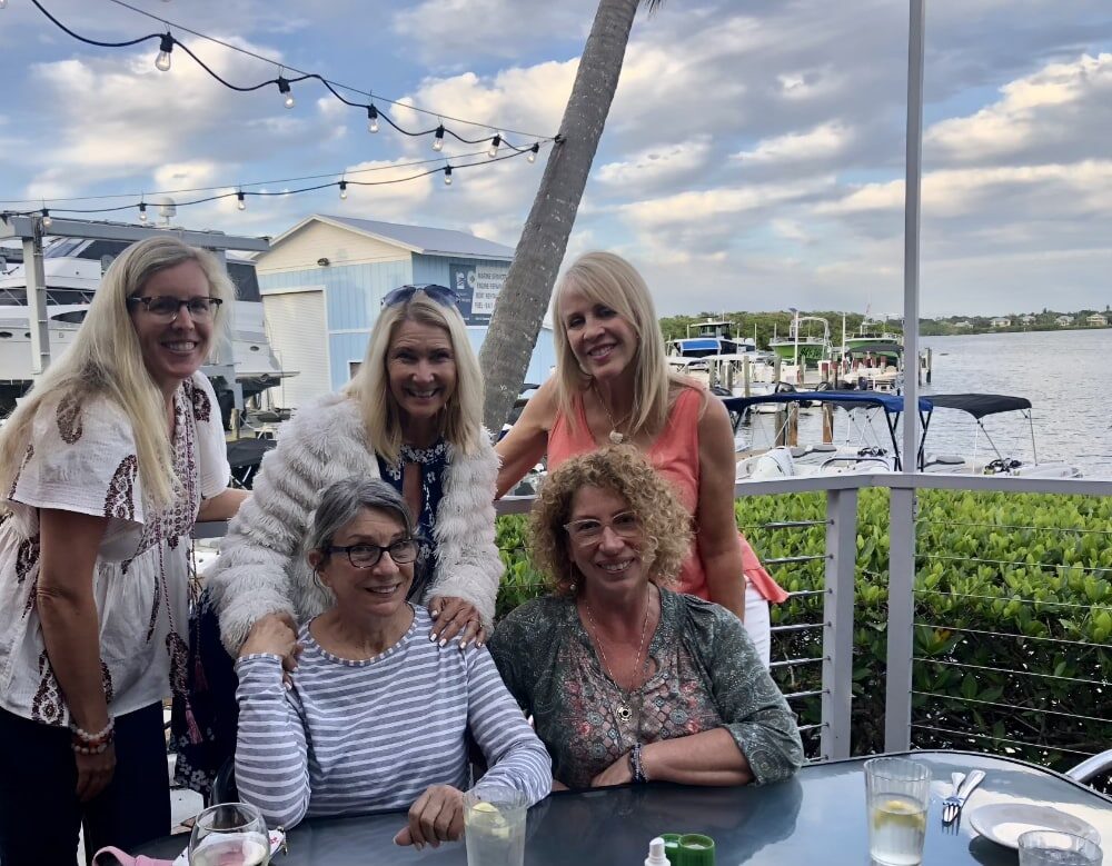 Authors gathered on the waterfront patio