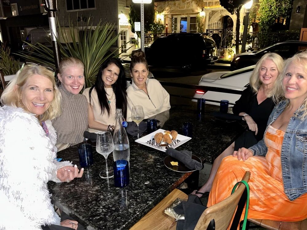 Authors sharing dinner during a writing retreat